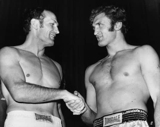 Boxers Henry Cooper (left) and Joe Bugner before the fight at Wembley in 1971 which proved to be Coopers last. Picture: Getty