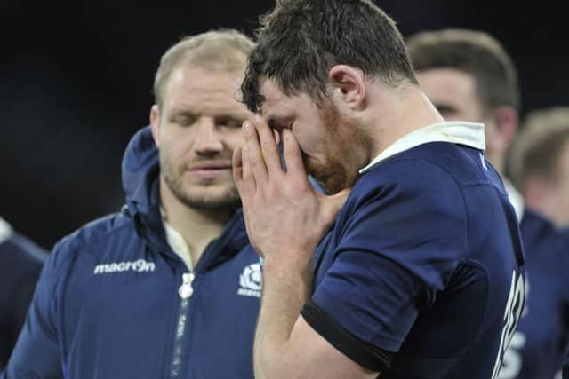 Scotlands replacement lock Tim Swinson puts his head in his hands after the defeat. Picture: Ian Rutherford