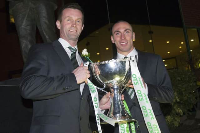 Manager Ronny Deila, left, and captain Scott Brown arrive at Celtic Park last night. Picture: SNS