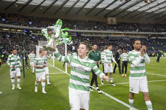 Celtic's Kris Commons celebrates with the cup. Picture: PA