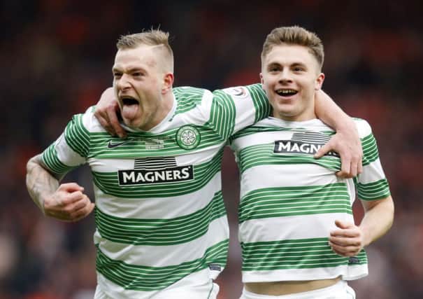 John Guidetti celebrates with James Forrest after the Scot doubled Celtic's lead. Picture: PA