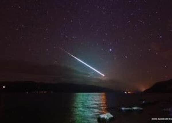 The stunning meteor was photographed from the shores of Loch Ness. Picture: John Alasdair Macdonald