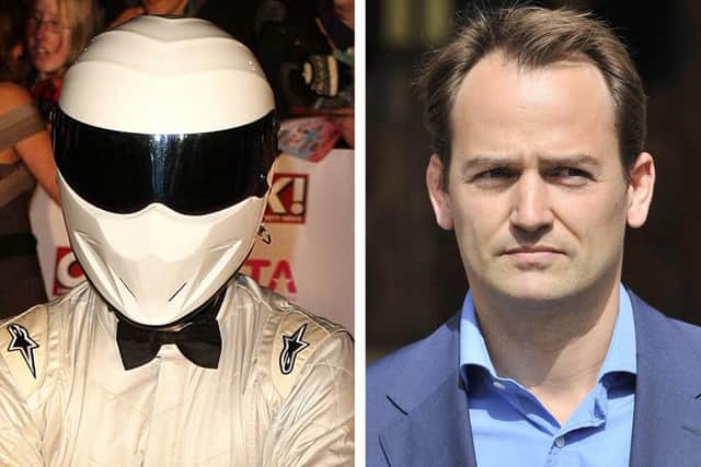 The Stig, left, and Ben Collins, the racing driver who was The Stig on Top Gear for eight years. Picture: PA