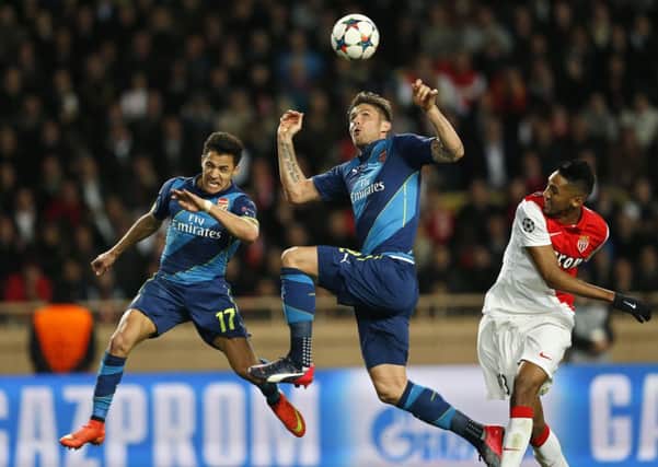 Arsenal's French striker Olivier Giroud jumps to control the ball against Monaco. Picture: Getty