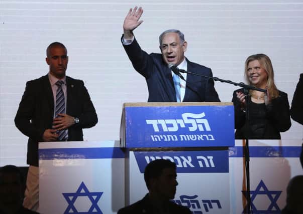Israeli Prime Minister Benjamin Netanyahu greets supporters at the party's election headquarters In Tel Aviv. Picture: AP
