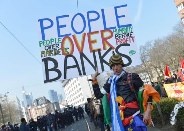 People over banks was a slogan adopted by many. Picture: AP