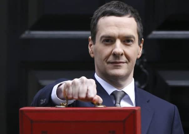 The Chancellor George Osborne with the red briefcase. Picture: AP