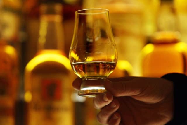Alcohol duty on whisky is to be cut by 2 per cent. Picture: PA