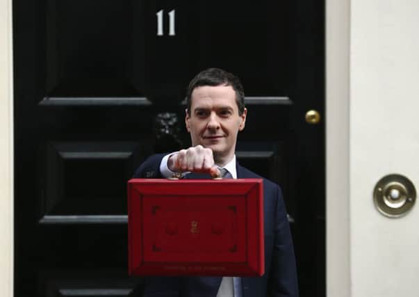 The Chancellor of the Exchequer George Osborne holds his ministerial red box. Picture: Getty