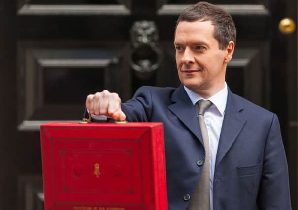 Chancellor George Osborne holds up the red box outside 11 Downing Street. Picture: PA