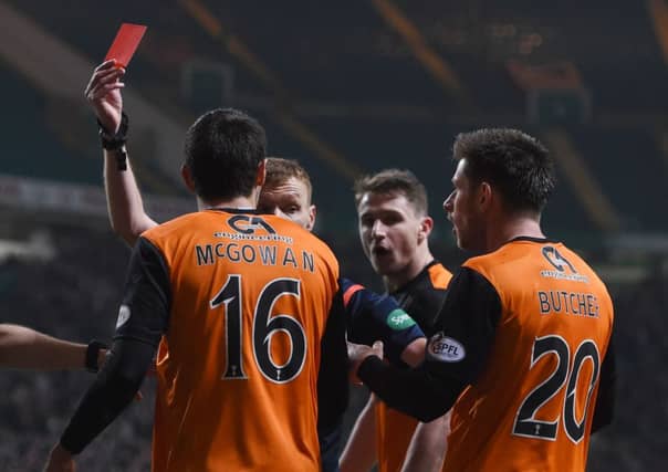 McGowan was sent off for a late lunge on Liam Henderson. Picture: SNS