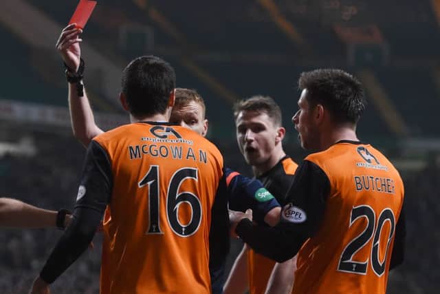 McGowan was sent off for a late lunge on Liam Henderson. Picture: SNS