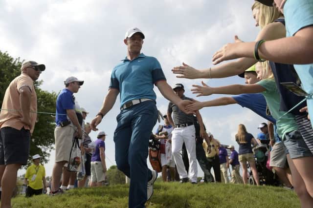 Rory McIlroy shakes hands with fans at the Arnold Palmer Invitational. Picture:  AP