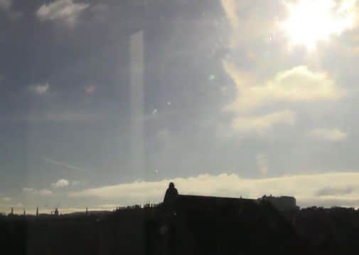 The solar eclipse begins above Edinburgh. Picture: Comp