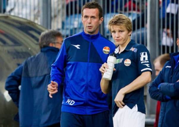 Ronny Deila and Martin Odegaard at Stromsgodset. Picture: PA