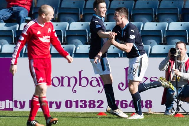 Dundee's Stephen McGinn (right) celebrates his goal with team-mate Alex Harris. Picture: SNS