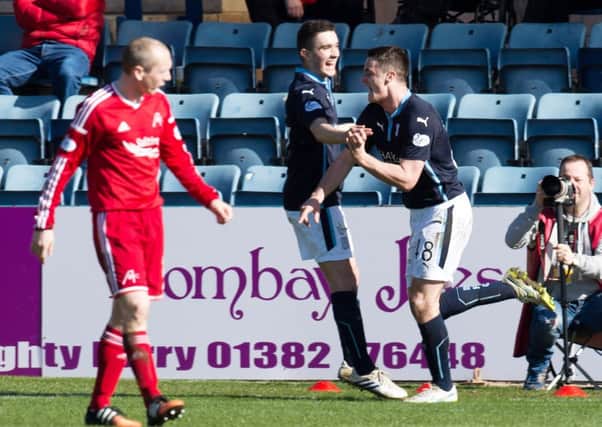 Dundee's Stephen McGinn (right) celebrates his goal with team-mate Alex Harris. Picture: SNS