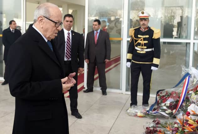 President Beji Caid Essebsi laying a wreath at the entrance of the National Bardo Museum. Picture: AFP/Getty