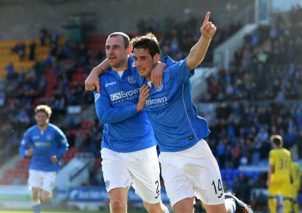 St Johnstone's Brian Graham (right) wheels away with team-mate Dave Mackay having opened the scoring. Picture: SNS