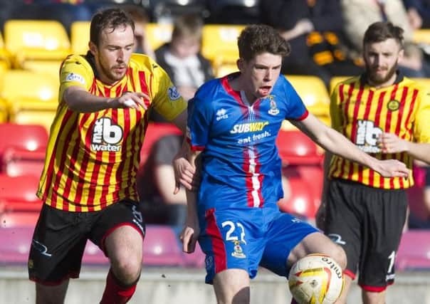 Partick Thsitle's Stuart Bannigan challeneges for the ball with Ryan Christie (right). Picture: SNS