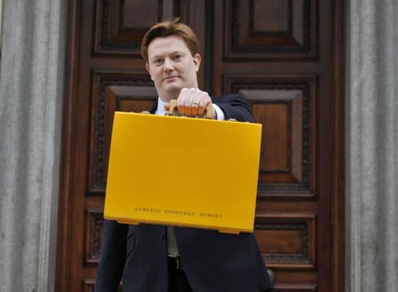 Danny Alexander holds his yellow budget box. Picture: PA