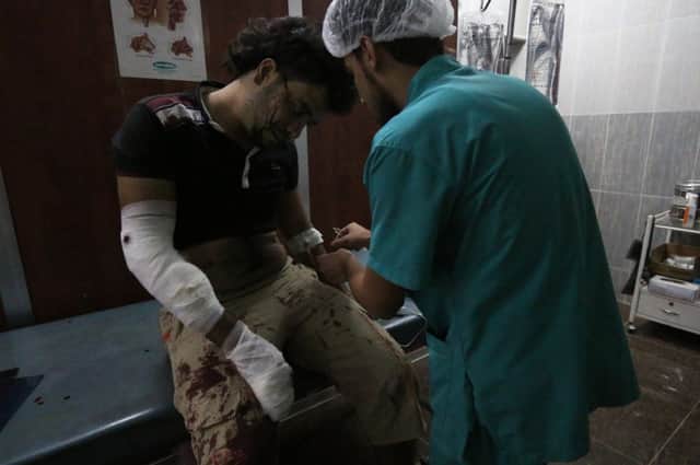 The nine students said they wanted to help the wounded like this man in Syria. Picture: AFP/ Getty