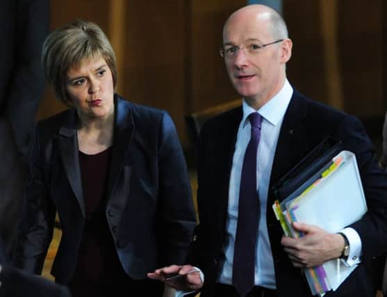 cotland's First Minister Nicola Sturgeon pictured leaving First Ministers Question Time with Finance secretary John Swinney. Picture: Ian Rutherford