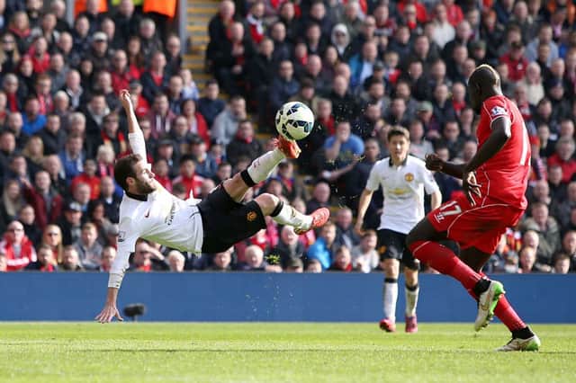 Manchester Uniteds Juan Mata fires in his second goal with a spectacular strike against Liverpool. Picture: PA