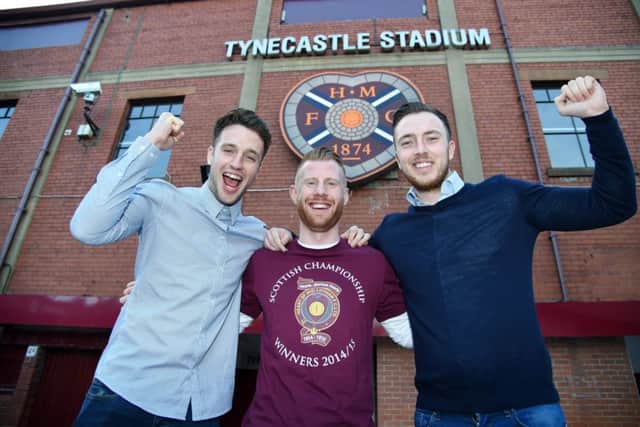 Brad McKay, Adam Eckersley and Danny Wilson celebrate outside Tynecastle yesterday. Picture: SNS