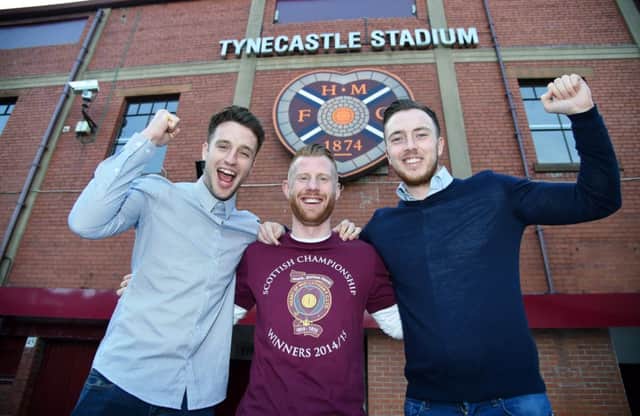 Brad McKay, Adam Eckersley and Danny Wilson celebrate outside Tynecastle yesterday. Picture: SNS