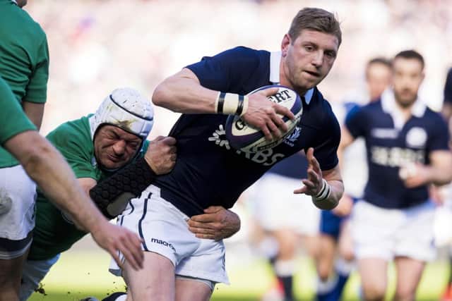 Finn Russell drives forward during Scotland's 40-10 defeat to Ireland. Picture: SNS