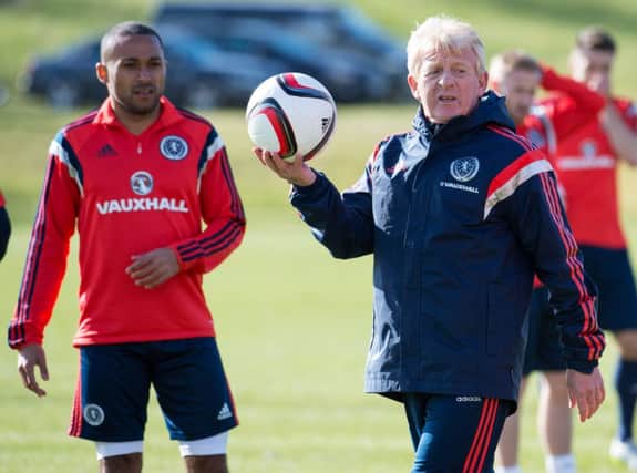 Gordon Strachan and Ikechi Anya at the Scotland training session yesterday. Picture: SNS