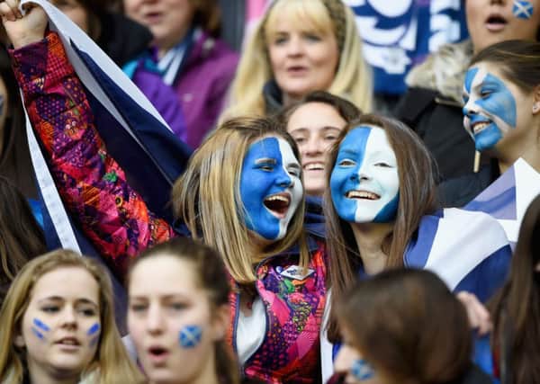 Smiling happy people at the recent Six Nations rugby. Picture: Getty