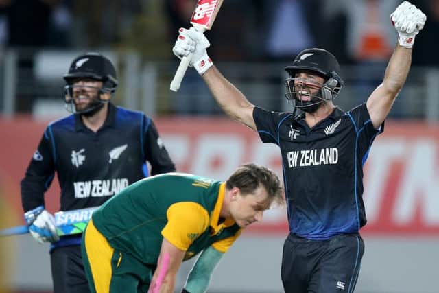 New Zealands Grant Elliott celebrates his matchwinning six. Picture: David Rowland/AP