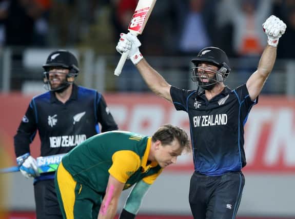 New Zealands Grant Elliott celebrates his matchwinning six. Picture: David Rowland/AP