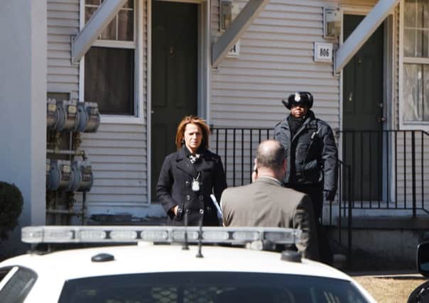 Police outside a home in Detroit in which two bodies were found. Picture: AP