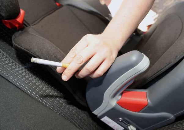 A ban on smoking in cars in the presence of children has been backed by MSPs. Picture: Gary Hutchison