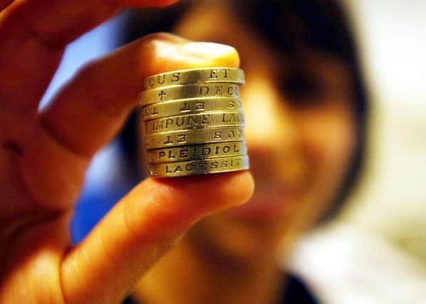The target for the number of firms paying the living wage in Scotland has already been hit, according to the Scottish Government. Picture: PA