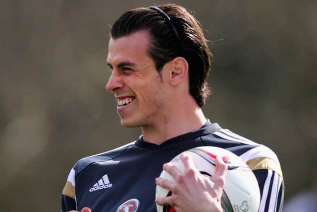 Gareth Bale was all smiles at Wales training yesterday. Picture: Getty