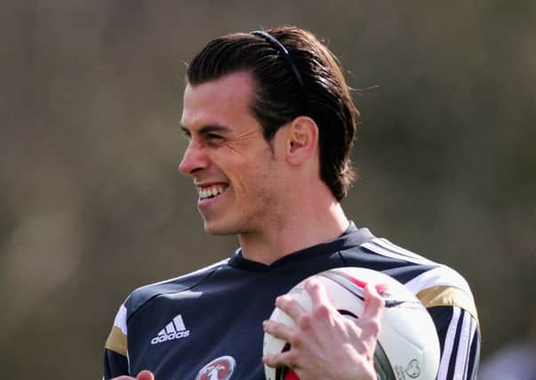 Gareth Bale was all smiles at Wales training yesterday. Picture: Getty