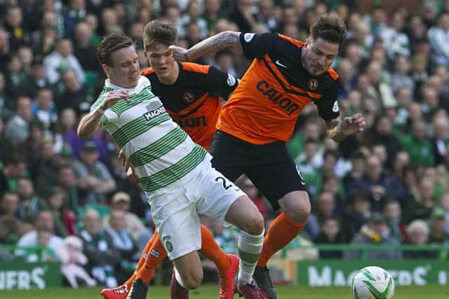 Stefan Johansen holds off Paul Paton of Dundee United in a Scottish Premiership clash. Celtic won 3-0. Picture: SNS