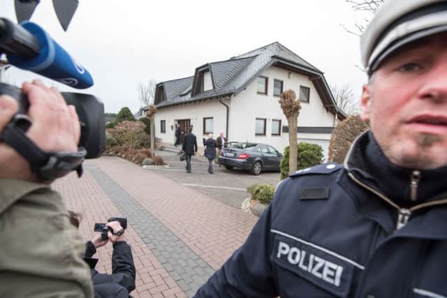 A policeman stands in front of the residence of the parents of Andreas Lubitz. Picture: Getty/AFP
