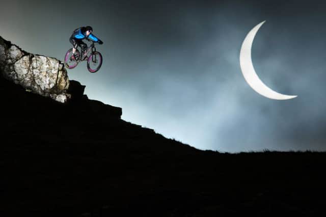 Danny MacAskill jumping at The Quirrang on the Isle of Skye during the solar eclipse. Picture: Rutger Pauw