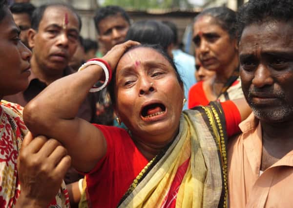 A relative of one of the ten people killed in the stampede during the bathing ritual near Dhaka. Picture: Getty