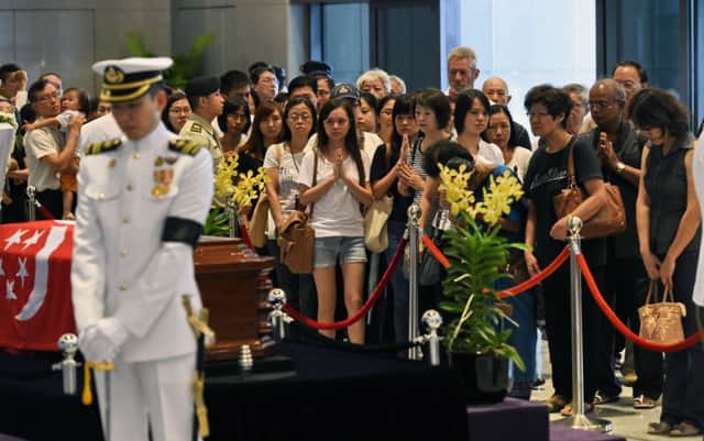Singaporean officials have urged the public to stay away as the queue to see Mr Lees coffin now stretches for miles. Picture: Getty