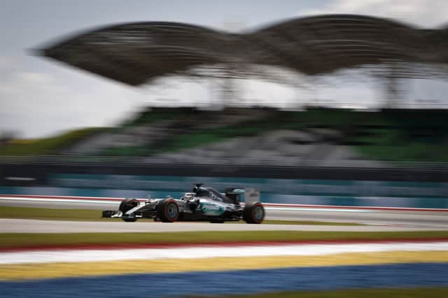 Lewis Hamilton steers his Mercedes around the Sepang International Circuit. Picture: Vincent Thian/AP