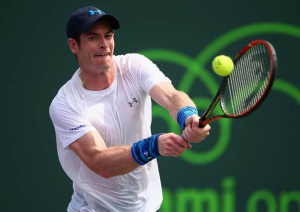 Andy Murray plays a backhand during his comfortable 64, 62 win over Donald Young. Picture: Getty