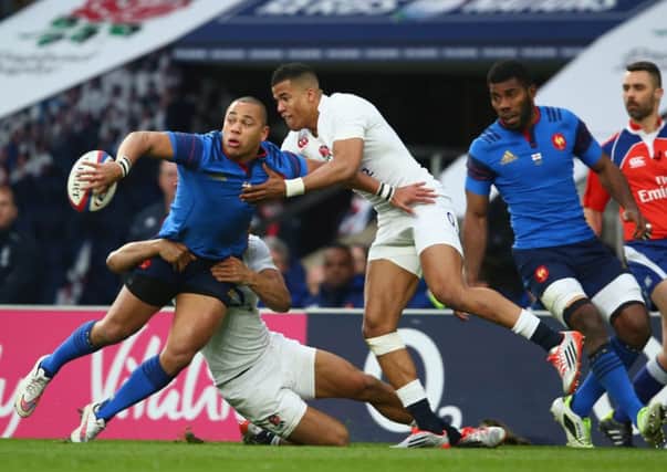 Gael Fickou offloads as Anthony Watson of England challenges. Picture: Getty