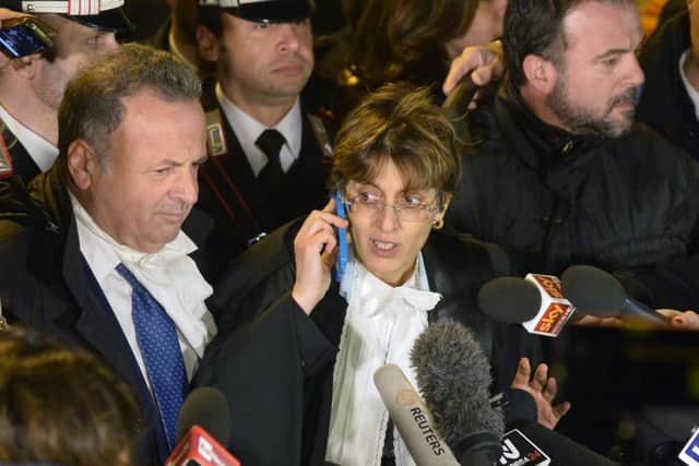 Raffaele Sollecito's lawyer Giulia Bongiorno talks to journalists as she leaves Italy's highest court building in Rome yesterday. Picture: Getty