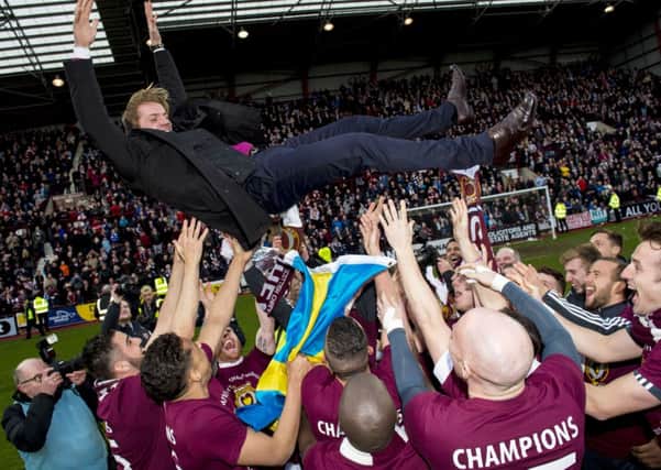 Hearts celebrate at full-time with head coach Robbie Neilson. Picture: SNS